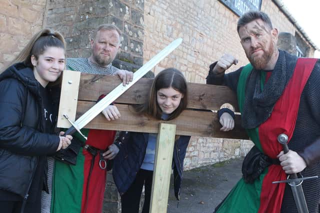 Locals Sophie Bowring and Elodie Beardsley are taken to the stocks by the Sheriff of Nottingham's men at the Warsop Old Hall Live Museum event.