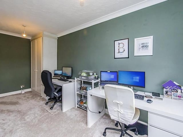One of the upstairs bedrooms has been turned into an office for professionals working from home. However, it is a versatile room that could be put to multiple uses.