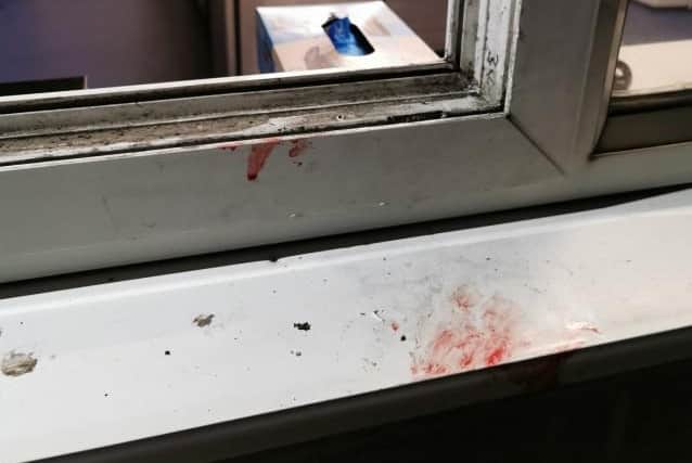Blood stains on the kitchen window frame of the Little John pub in Ravenshead.