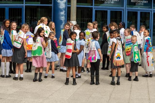 Children from 30 Nottinghamshire and Derbyshire schools created artwork on capes for the Flying High Trust Awards event, at Nottingham's Motorpoint Arena.