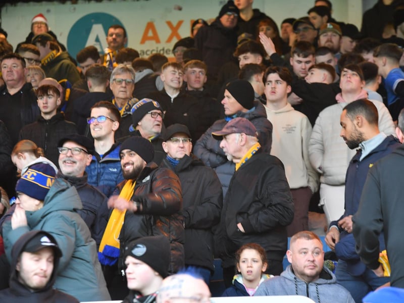 Mansfield Town fans watch the brilliant win at Peterborough United.