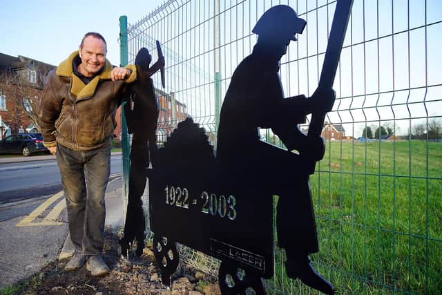 Owner Stuart Mills pictured with the new art piece