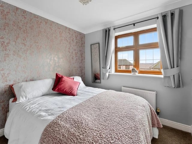One of five spacious bedrooms in the property.