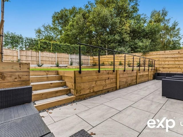 The ample garden is professionally lawned and landscaped to include a patio seating area, providing plenty of space for garden furniture and for alfresco dining.