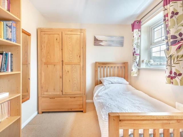 The third bedroom at the Cotswold Grove property is a cosy retreat, with space for furniture and wardrobes.