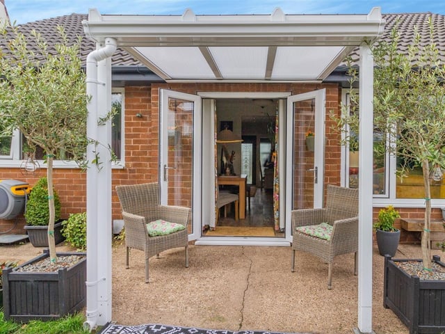 The grand, covered exit from the French doors in the lounge/diner of the Cauldwell Road bungalow to the back garden