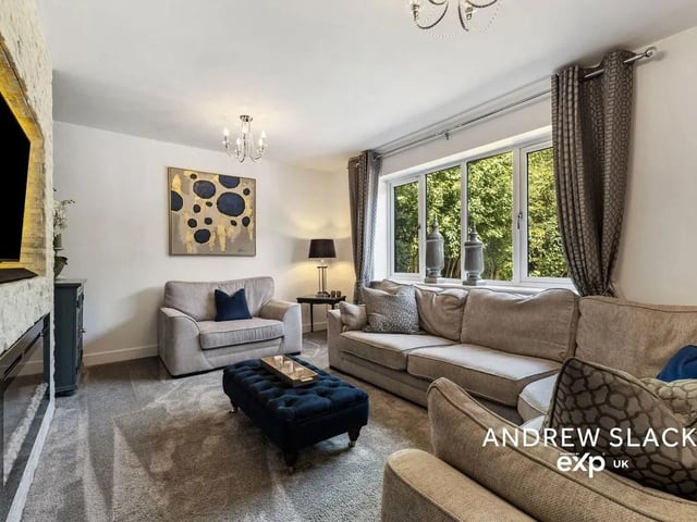 Relax in the stylish formal lounge with contemporary feature fireplace.