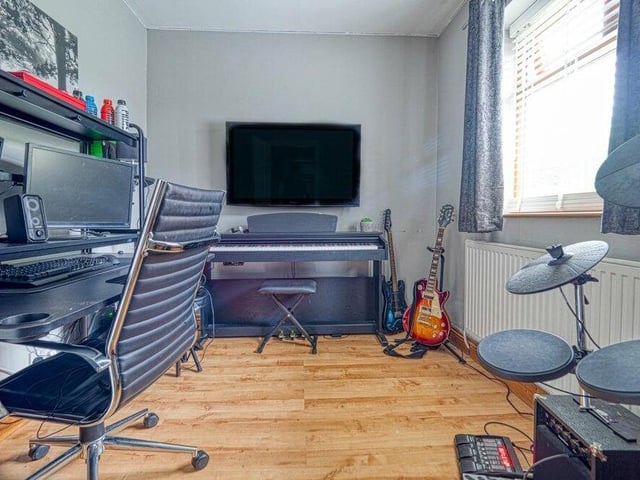 This third bedroom on the ground floor of the Church Hill property is currently being used as a study and music room.