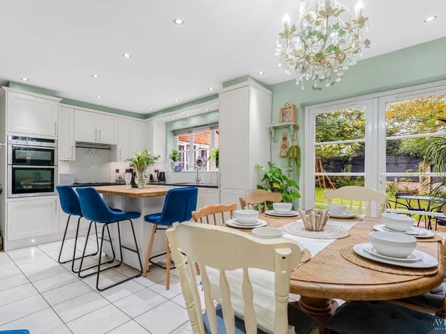 The kitchen is filled with modern design features and bags of natural light