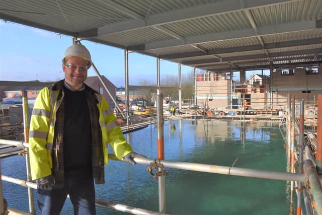 Coun Jason Zadrozny, leader of Ashfield District Council, by the 25-metre pool, which was filled with water for the first time this week as part of the construction of the new Kirkby Leisure Centre.
