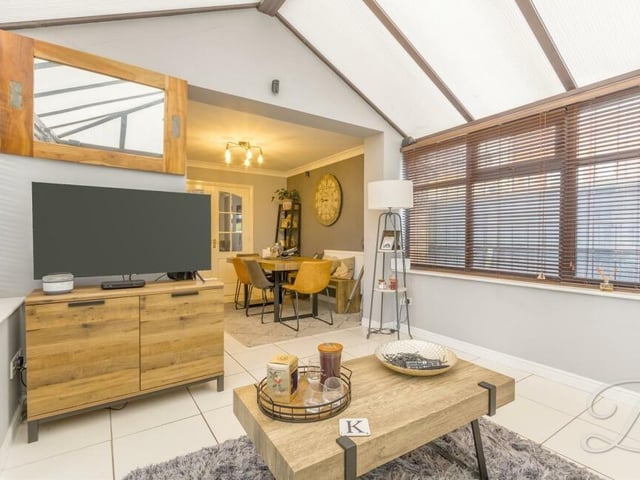 The conservatory could also be used as a quiet retreat, relaxing in front of the telly.