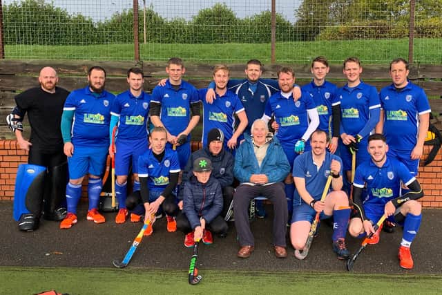 North Notts Hockey Club's First Team, pictured with 93-year-old club founder John Tomlinson.