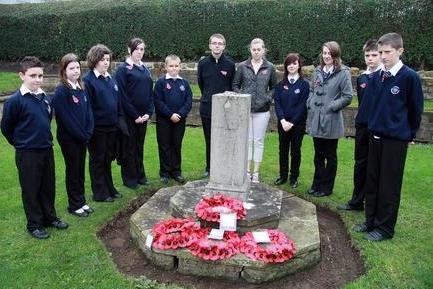 2011: Pupils from Eastwood Comprehensive School pay their respects with a two-minute silence at Eastwood Memorial Cottages.