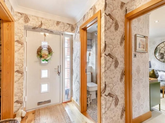 Come with us on a tour of the £465,000 Sutton property, starting in the entrance hall, which has an oak floor, coving to the ceiling, a recess area and a built-in storage cupboard.