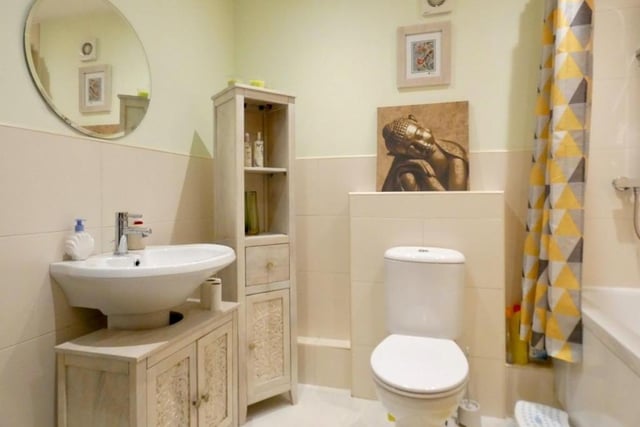 The modern, three-piece bathroom on the first floor is charming, little number.