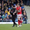 Aden Flint leaves the field injured on Saturday. Photo by Chris & Jeanette Holloway/The Bigger Picture.media.