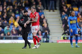 Aden Flint leaves the field injured on Saturday. Photo by Chris & Jeanette Holloway/The Bigger Picture.media.