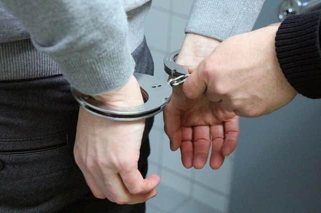 Two people have been charged over the offence.