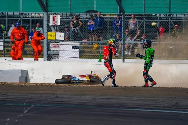 Max Cook gets up unharmed after opening meeting crash at Silverstone.