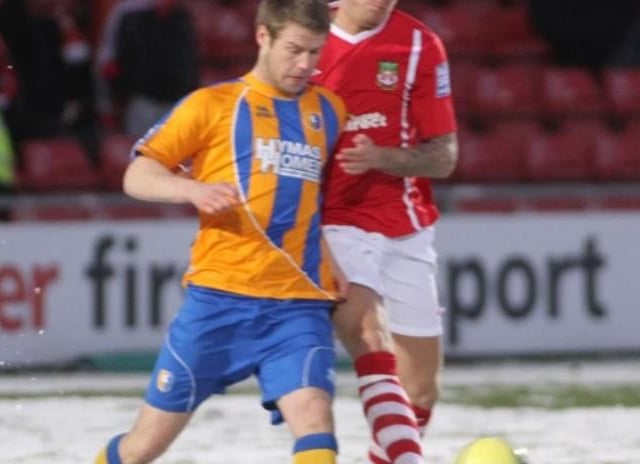 Jamie Tolley tussles for the ball.