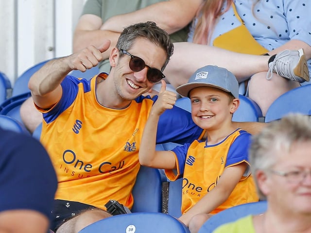 Mansfield fans watch the Carabao Cup first round match against Derby County FC at the One Call Stadium.
