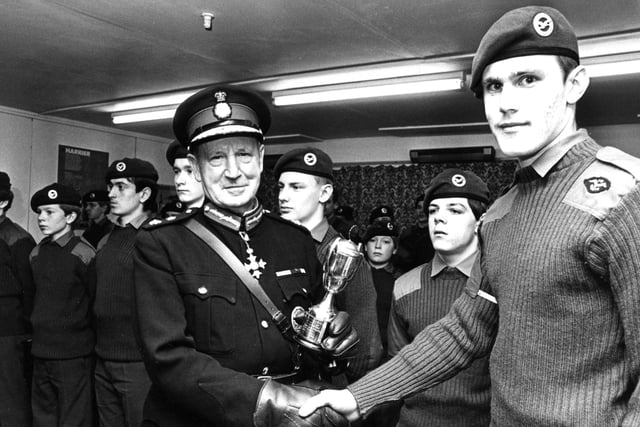 Sir James Steel, Lord Lieutenant of Tyne and Wear, presents the trophy for the best cadet to Cadet Philip Farrel at an open night held by No 324 (South Shields) Squadron, Air Training Corps at their headquarters at Northfield Gardens.