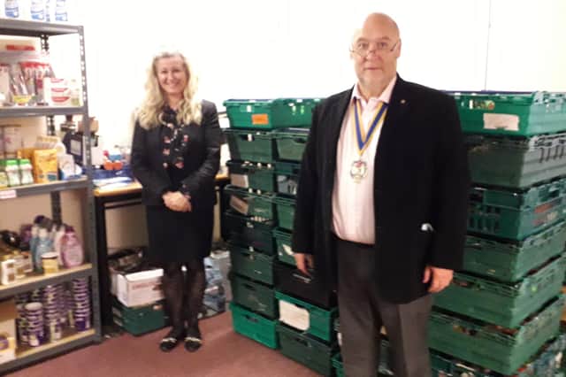 Chris Dawes, president of Sutton in Ashfield Rotary Club, with Linda Smith, manager of the Let's All Eat Food Bank.