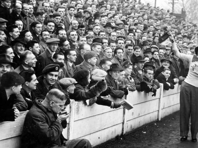 Mansfield Town fans pack into Field Mill during an FA Cup tie in 1953 with Nottingham Forest. It saw a record crowd of 24,467 set.
