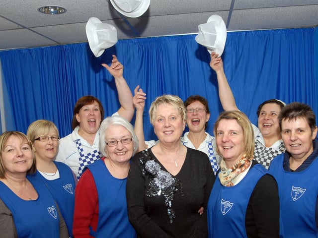 Cooking supervisor Ann Walker, centre, is congratulated on her retirement from the St. Mary's Primary School in Sutton, by her colleagues after she left her post at Christmas after 23 years service.