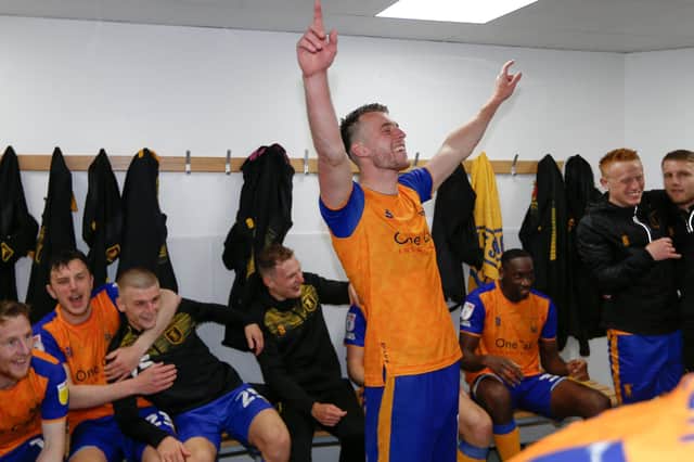 Rhys Oates leads the dressing room celebrations.