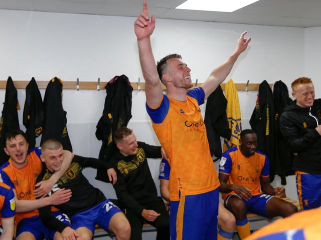 Rhys Oates leads the dressing room celebrations.