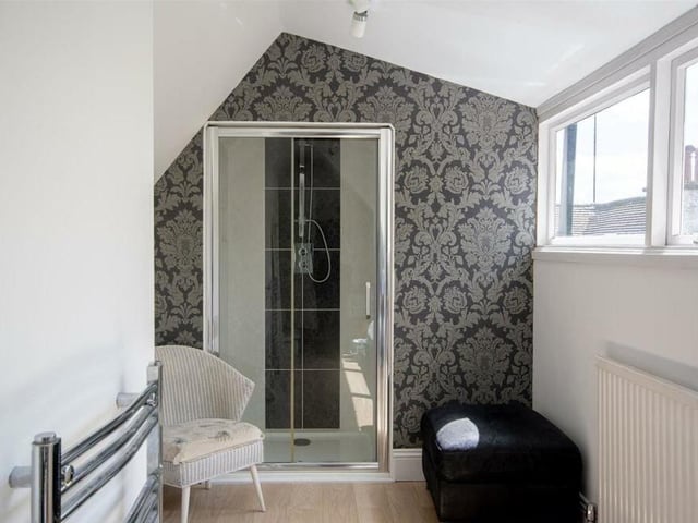 The unique nature of the pretty en suite shower room, attached to the fourth bedroom, is so typical of the property's personality. It is fitted with an enclosed shower, wash hand basin and heated towel-rail.