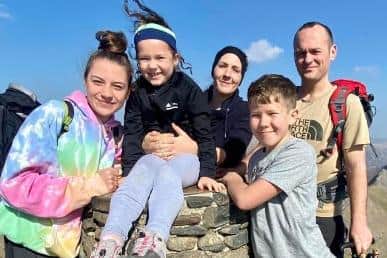 Megan Stammers-Bennett (centre) with family and friends at the top of Mount Snowdon last year.