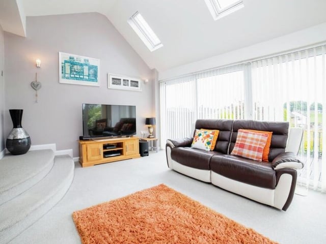 The lounge isn't the only reception room within the bungalow because, towards the back, steps from the dining area lead into this fantastic family room, which boasts doors leading to the rear garden.