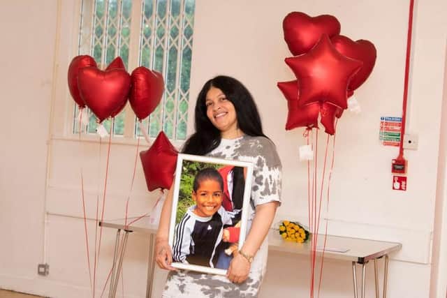 Keishaye Steede with a portrait of her son Lyrico.