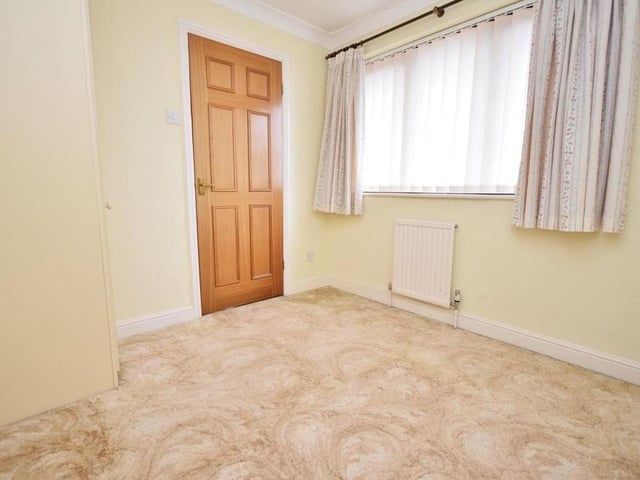 The third bedroom is smaller than the first two, but there is still space for a double bed, not to mention built-in wardrobes.