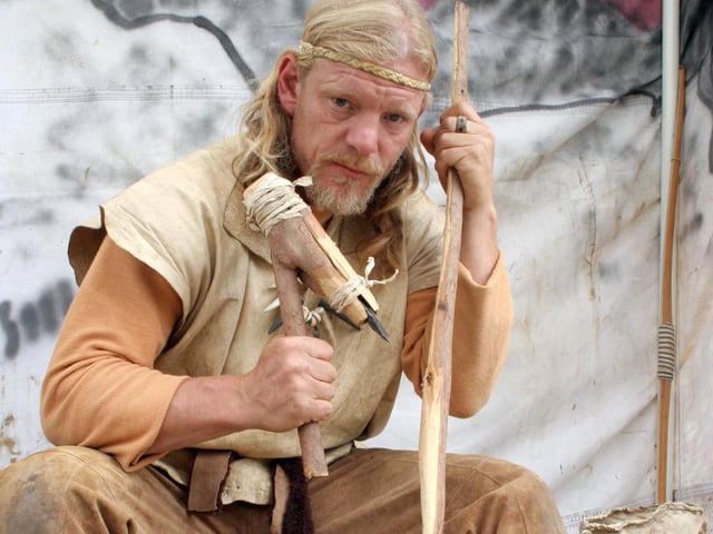 Will Lord demonstrated flint napping and tool usage at Creswell Crags.