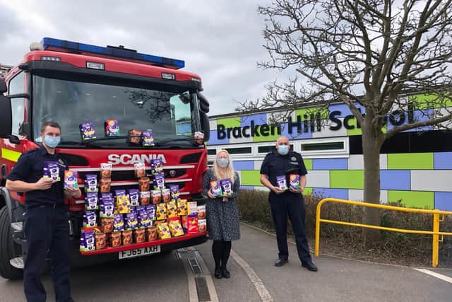 Kelly Jefferies, one of Bracken Hill School's assistant headteachers being given the eggs by firefighters from Ashfield Fire Station, who dropped them off at the school.