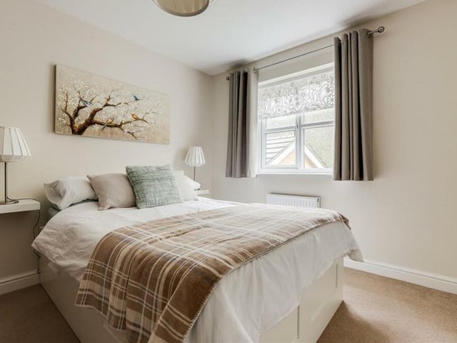 The second bedroom, which overlooks the back of the Annesley house, is tastefully presented.