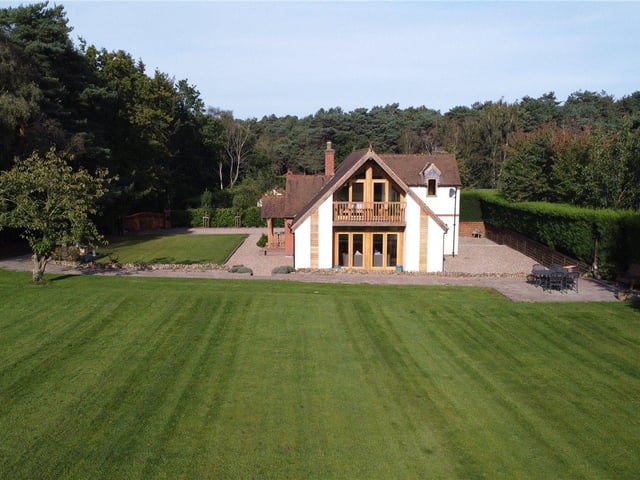 The garden is mostly lawn, bordered by a fully secure fence and hedge. CCTV cameras and an alarm system add further security.