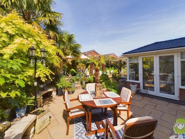 Here's what you've been waiting for -- a look at the tropical garden, which induces the wow factor at the Forest Town house. This patio area, with space for seating, is a delight.
