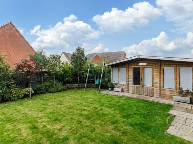 A highlight of the garden is this sizeable summer outbuilding, which is the perfect place to relax or entertain family and friends.