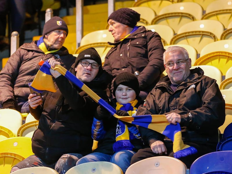 Mansfield Town's faces in the crowd against Swindon Town.
