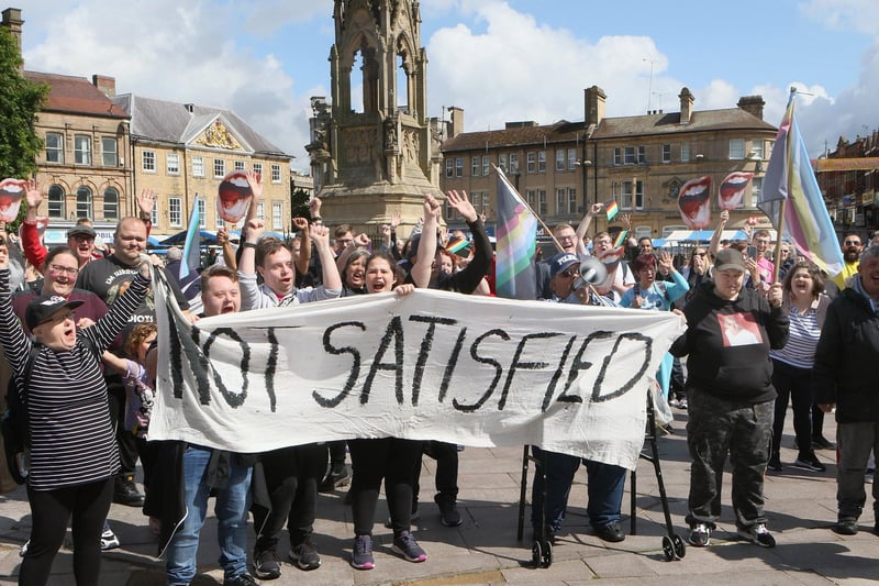 OneFest Pride March. Activists call for change with a 'Not Satisfied' banner in Mansfield.