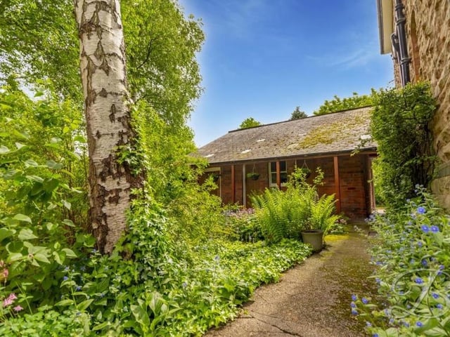 The extensive garden at the Mansfield mansion includes a collection of outbuildings and stores.