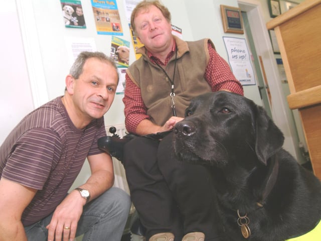 Ashfield vet Frank Flynn, took part in a desert walk to raise funds for Dogs For The Disabled. Frank is pictured with Ken Heathcote of Kirkby and his 'Dog For The Disabled' Petra who was three years old at the time.