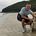 Blind footballer Nathan Edge with guide dog Hudson.