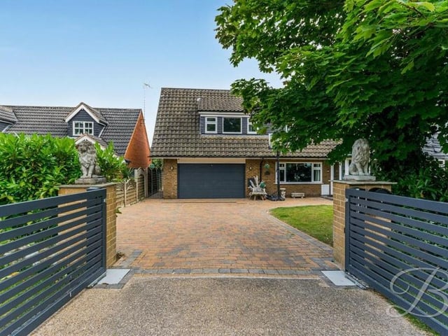 Back to the front now to see the gated entrance to the house and its driveway, which provides off-street parking space and leads to an integral double garage.
