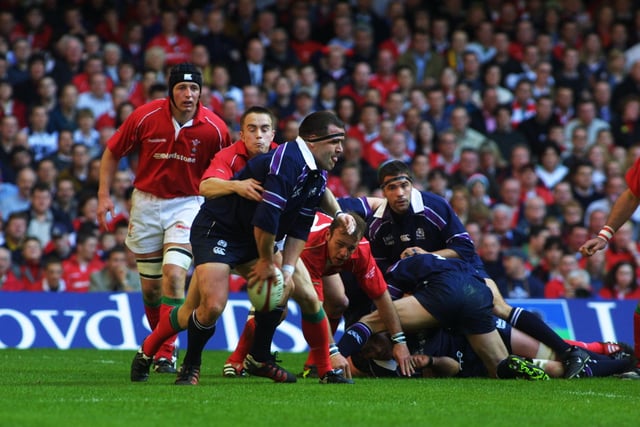 Tom Smith is tackled by Rhys Williams of Wales. The Scotland prop was part of an exceptional pack which included fellow Lions Gordon Bulloch, Scott Murray and Simon Taylor.