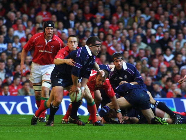 Tom Smith is tackled by Rhys Williams of Wales. The Scotland prop was part of an exceptional pack which included fellow Lions Gordon Bulloch, Scott Murray and Simon Taylor.